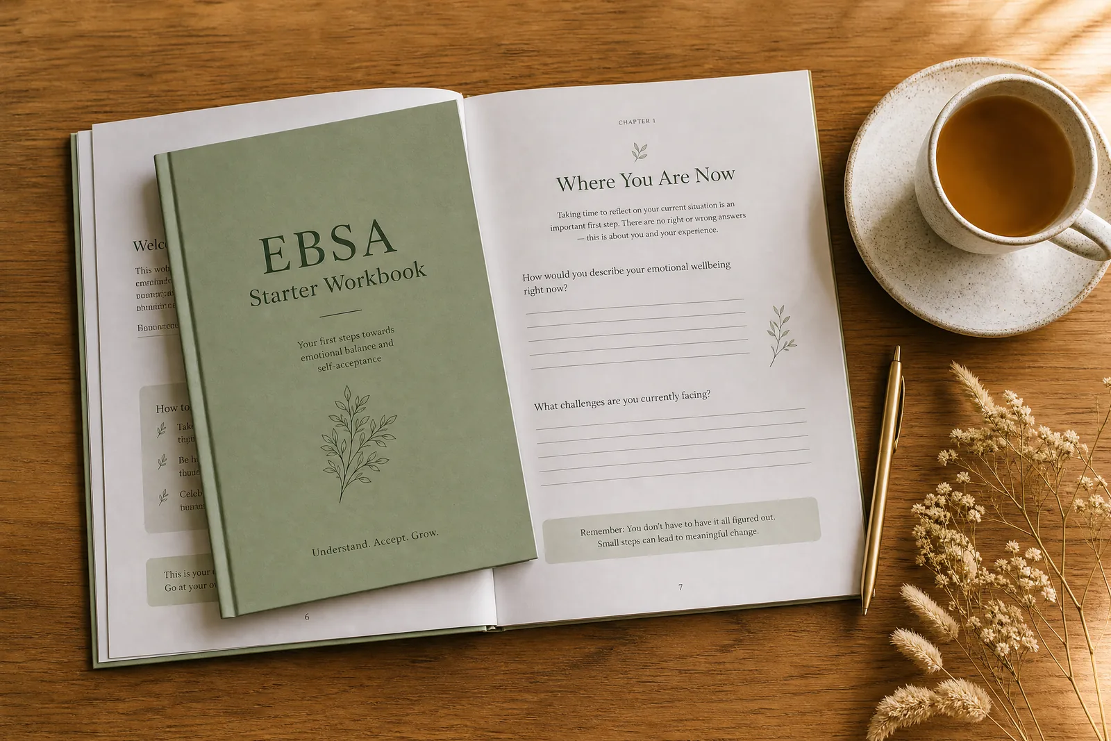 The EBSA Starter Workbook open on a wooden table with a cup of tea